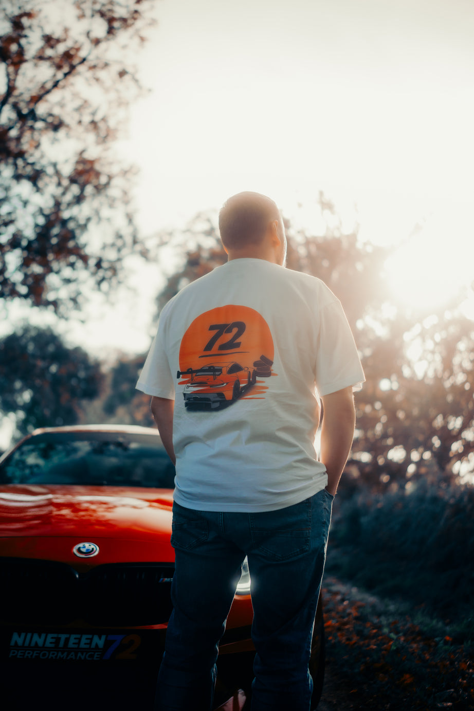 Nineteen72 Performance Flat Six Sunset T-Shirt with colorful graphic design on front, soft cotton fabric, and classic fit.