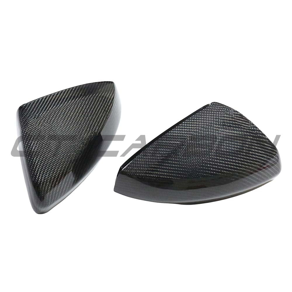 VW Polo MK6 2019+ CT Carbon dry carbon fiber mirror cover replacements on a vehicle with reflective finish and detailed texture.