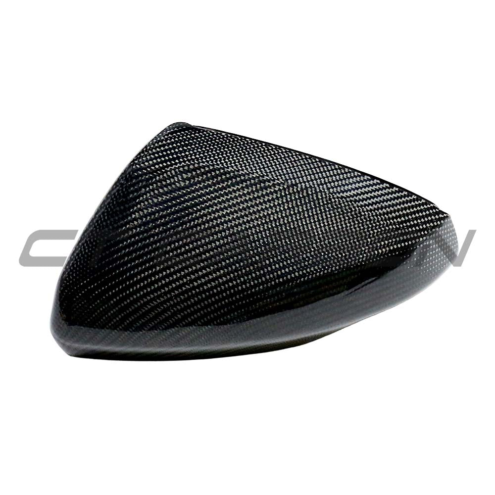 VW Polo MK6 2019+ CT Carbon dry carbon fiber mirror cover replacement on side mirror, showcasing sleek, textured finish.