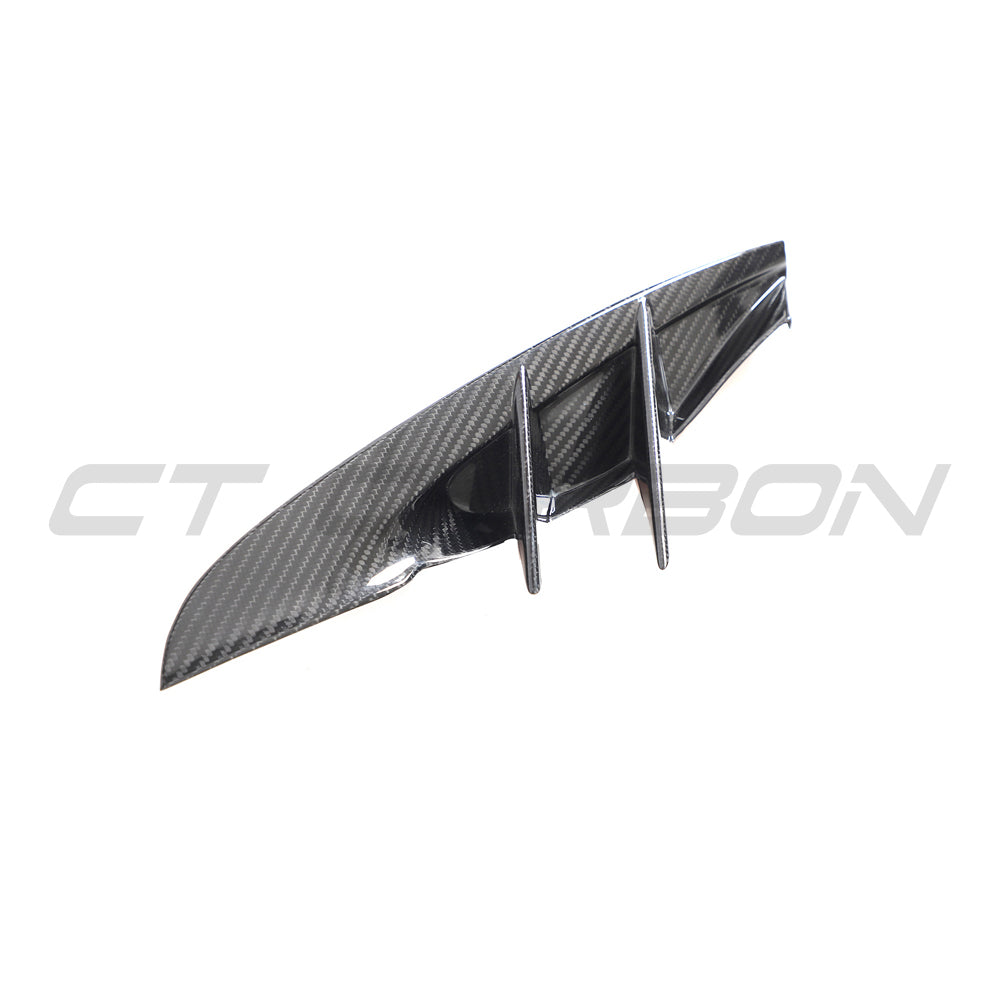 Carbon fiber front bumper vent trim for Toyota Supra 2019+ A90 by CT Carbon, shown installed on the vehicle's front bumper.