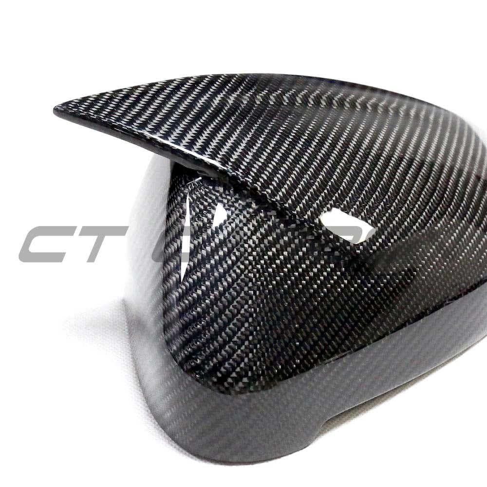 Carbon fiber mirror covers for Audi A4 B9 (2015-2023) by CT Carbon, showing sleek, textured mirror caps on the vehicle.