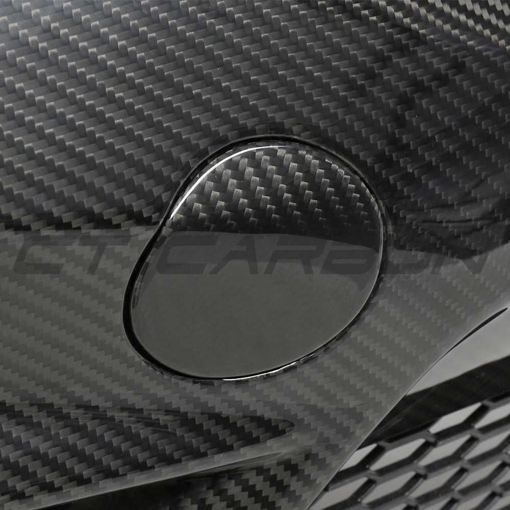 BMW F87 M2C carbon pre-preg fibre front bumper by CT Carbon showing sleek black finish and aerodynamic design details.