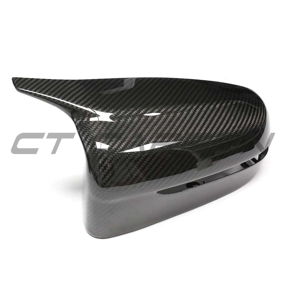 BMW G42 2 Series 2022+ LHD dry carbon mirror cover replacement by CT Carbon, showing sleek, textured carbon fiber mirror housing.