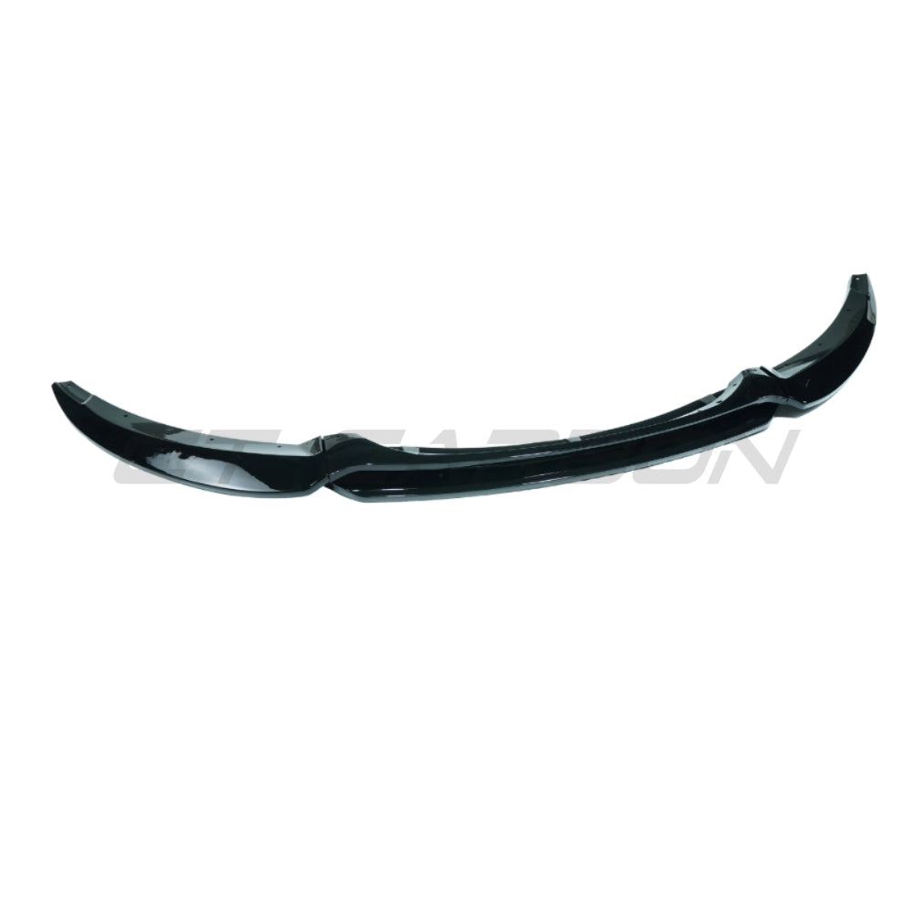 Gloss black BMW E82/E88 1 Series LCI splitter by CT Carbon, showcasing the sleek aerodynamic design for 2007-2013 models.