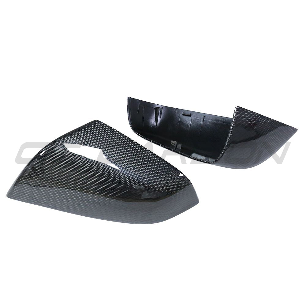 Tesla Model S 2013-2020 carbon fibre mirror accessories by CT Carbon, featuring sleek carbon fiber side mirrors.