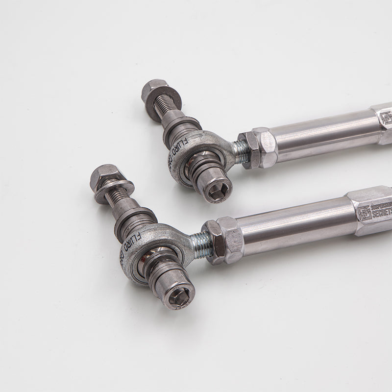 Suspension Secrets adjustable bump steer tie rod ends for Porsche 981 Cayman and Boxster GT4 suspension linkages, showing metal components.