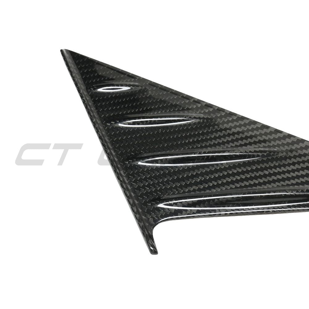 BMW G82 M3 2020+ dry carbon fibre mirror pillar trim by CT Carbon, close-up of sleek, lightweight accessory for vehicle enhancement.
