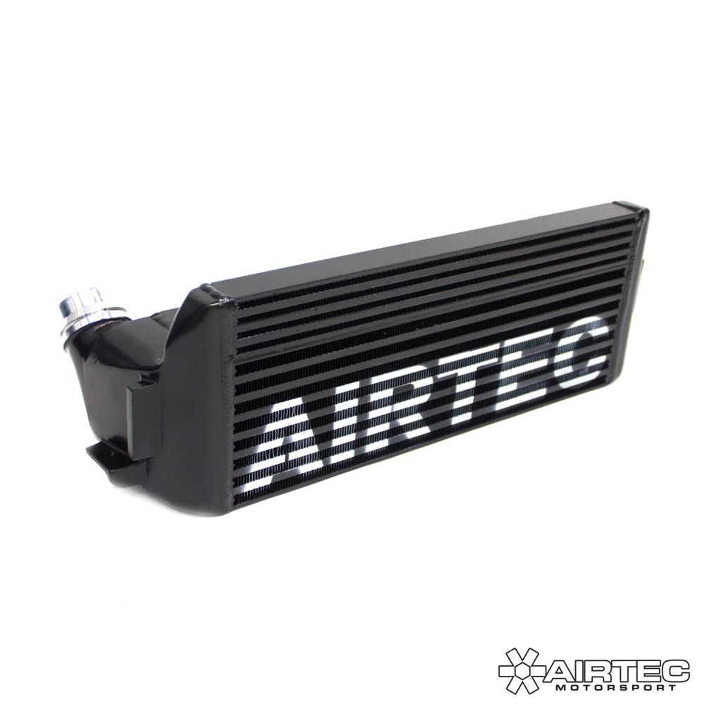 Airtec Motorsport intercooler upgrade for BMW N55 engine, large aluminum core with black end tanks and mounting brackets.