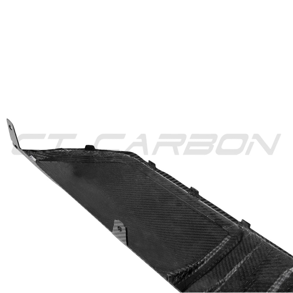 BMW 3 Series G20 G21 2022+ LCI carbon fibre diffuser with round tips by CT Carbon, shown installed on the rear of the vehicle.