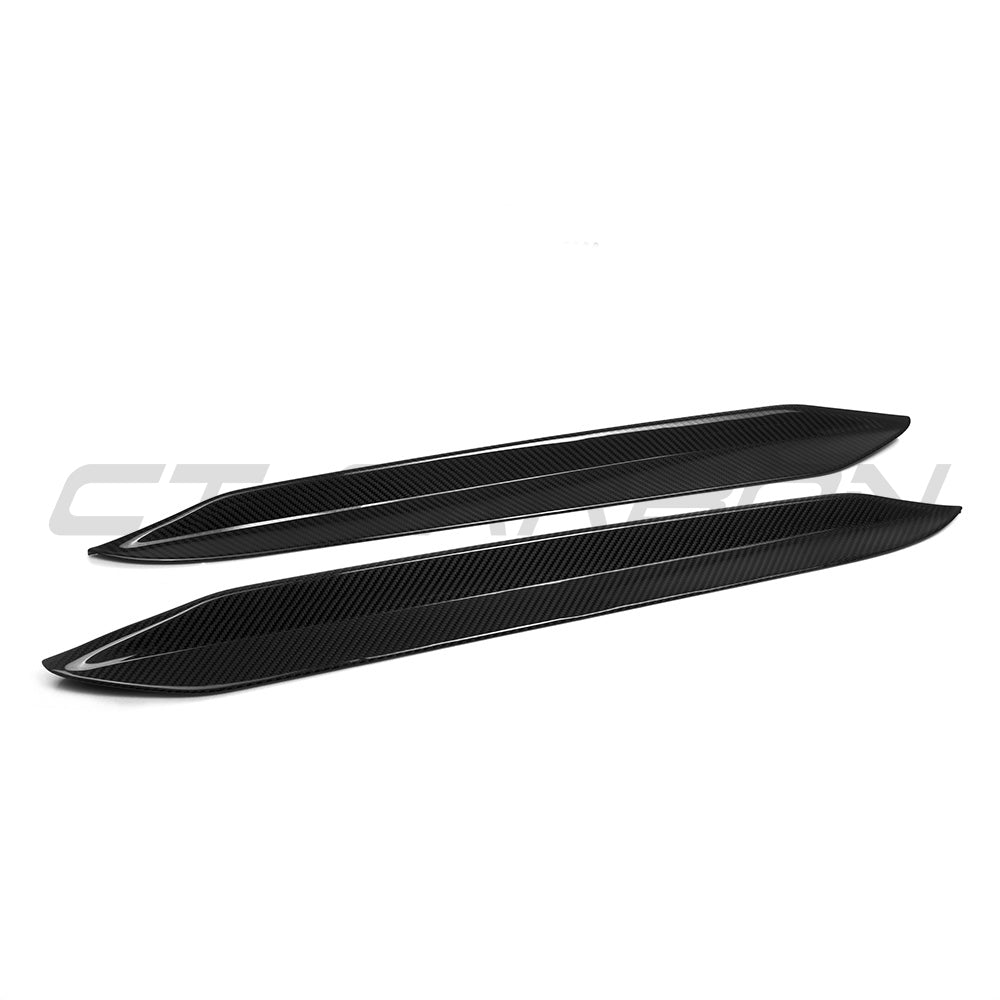 BMW X6 G06 2019+ carbon fibre rear window trims by CT Carbon, close-up of sleek, textured accessory on vehicle window.