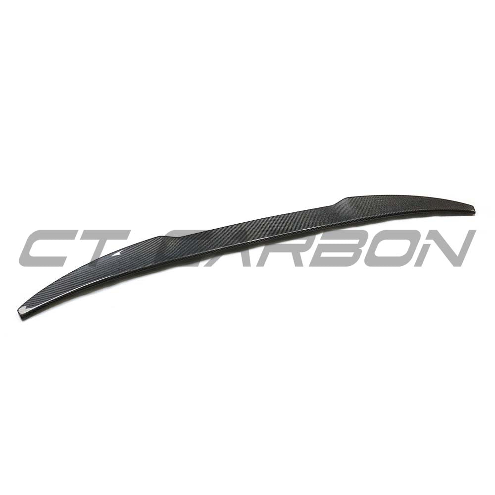 BMW F98 X4M Carbon Fibre Spoiler by CT Carbon, showing sleek, black carbon fiber design on the car's rear.