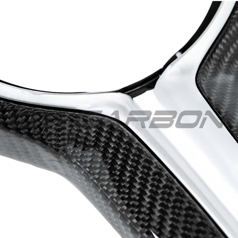 BMW Fxx M series carbon fiber steering wheel trim by CT Carbon, showing sleek, textured carbon fiber accents on the steering wheel.