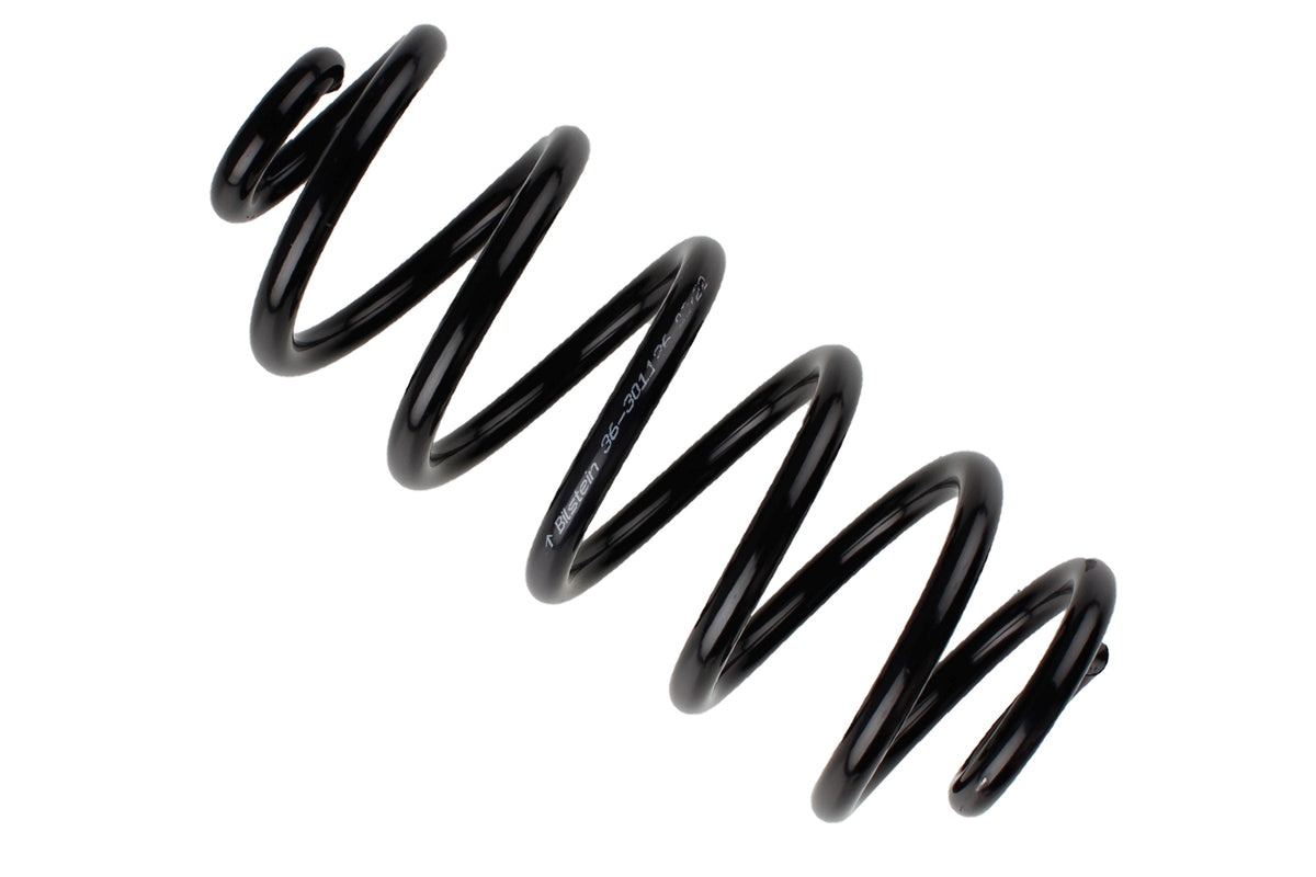 Bilstein B3 OE replacement coil springs for BMW X5 E70, shown in a close-up image with black metal finish.
