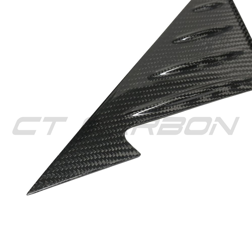 BMW G87 M2 2023 dry carbon fibre mirror pillar trim by CT Carbon, showcasing sleek, textured carbon fiber accessory on vehicle mirror pillar.