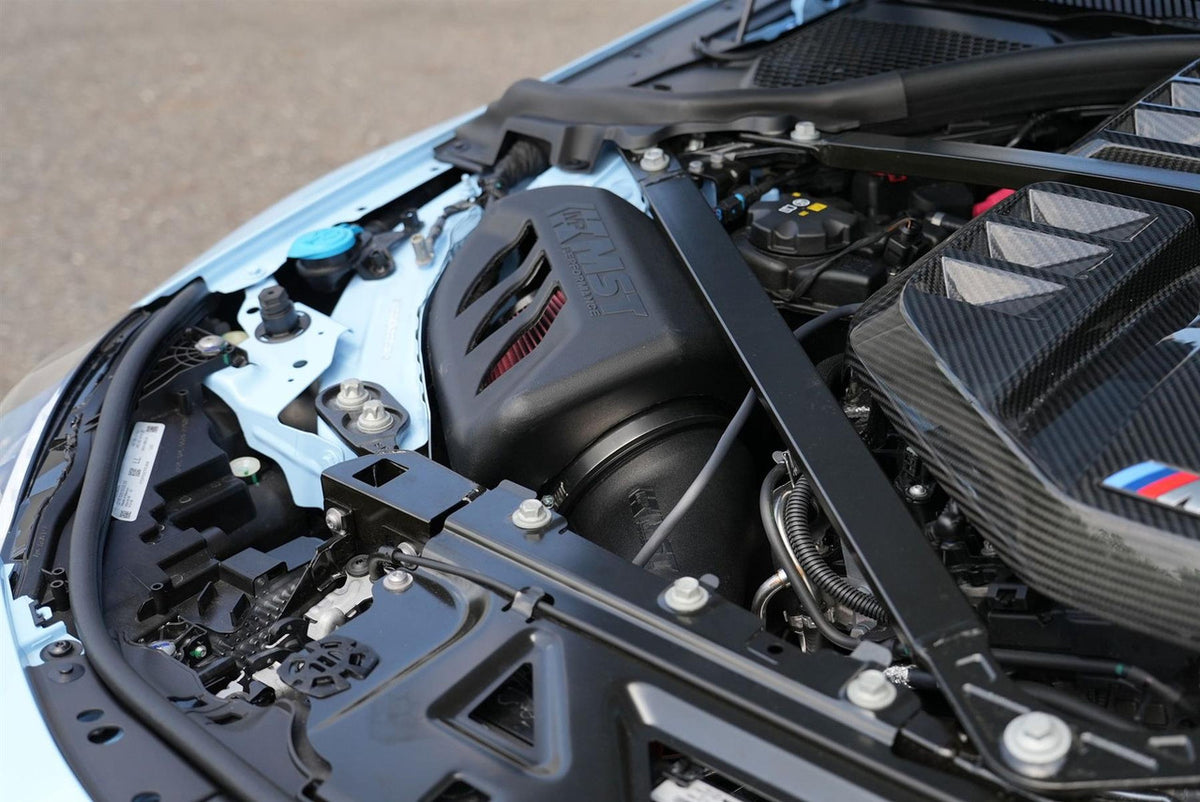 MST Performance intake kit for BMW G80 G82 M3 M4 Competition with S58 engine, featuring air filters and intake hoses.