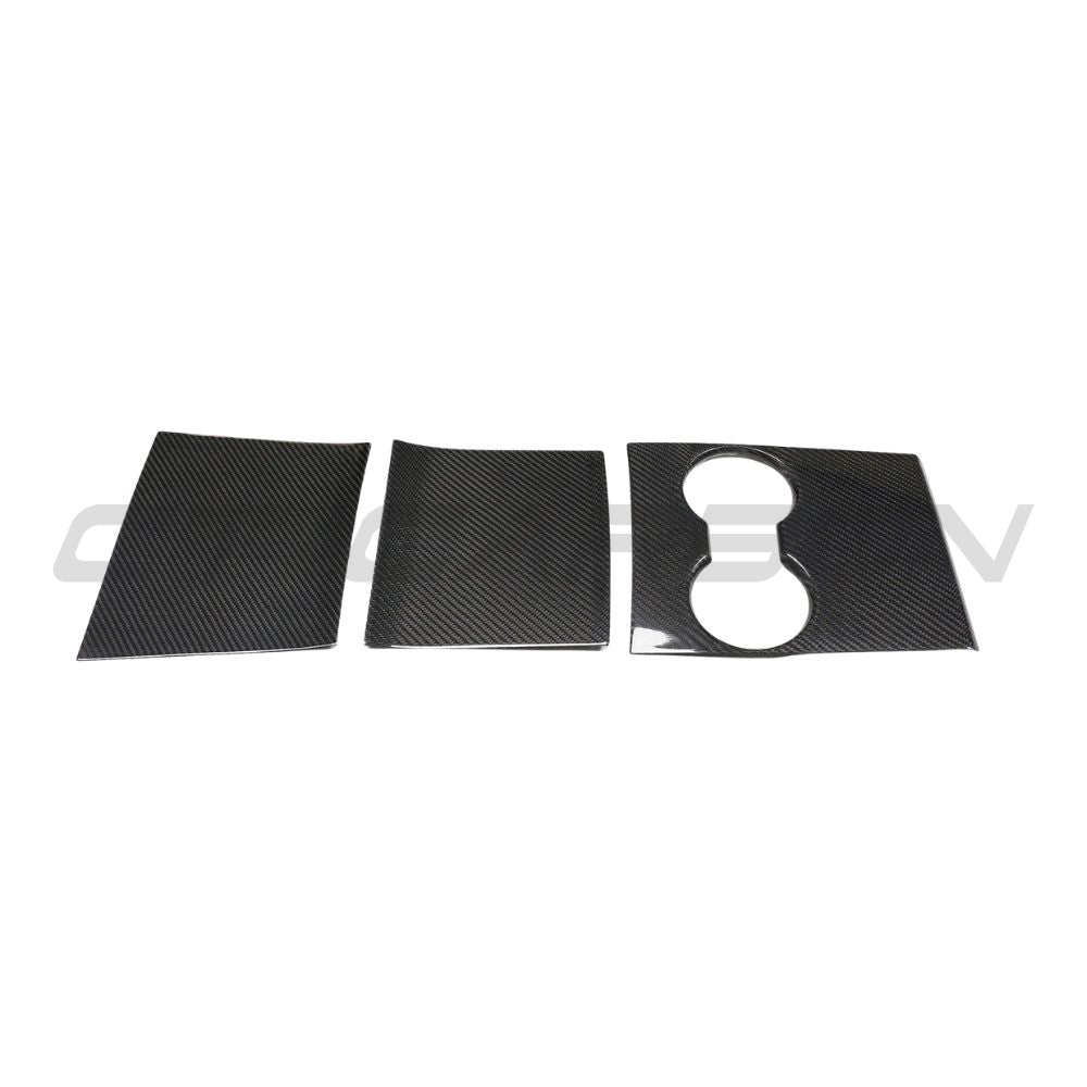 Carbon fiber center console add-on for Tesla Model 3 2017-2023 by CT Carbon, shown installed in the vehicle interior.