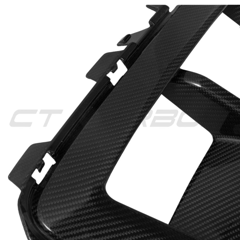 BMW X5M LCI 2023+ carbon fibre front bumper trim by CT Carbon, close-up view of sleek, lightweight accessory.
