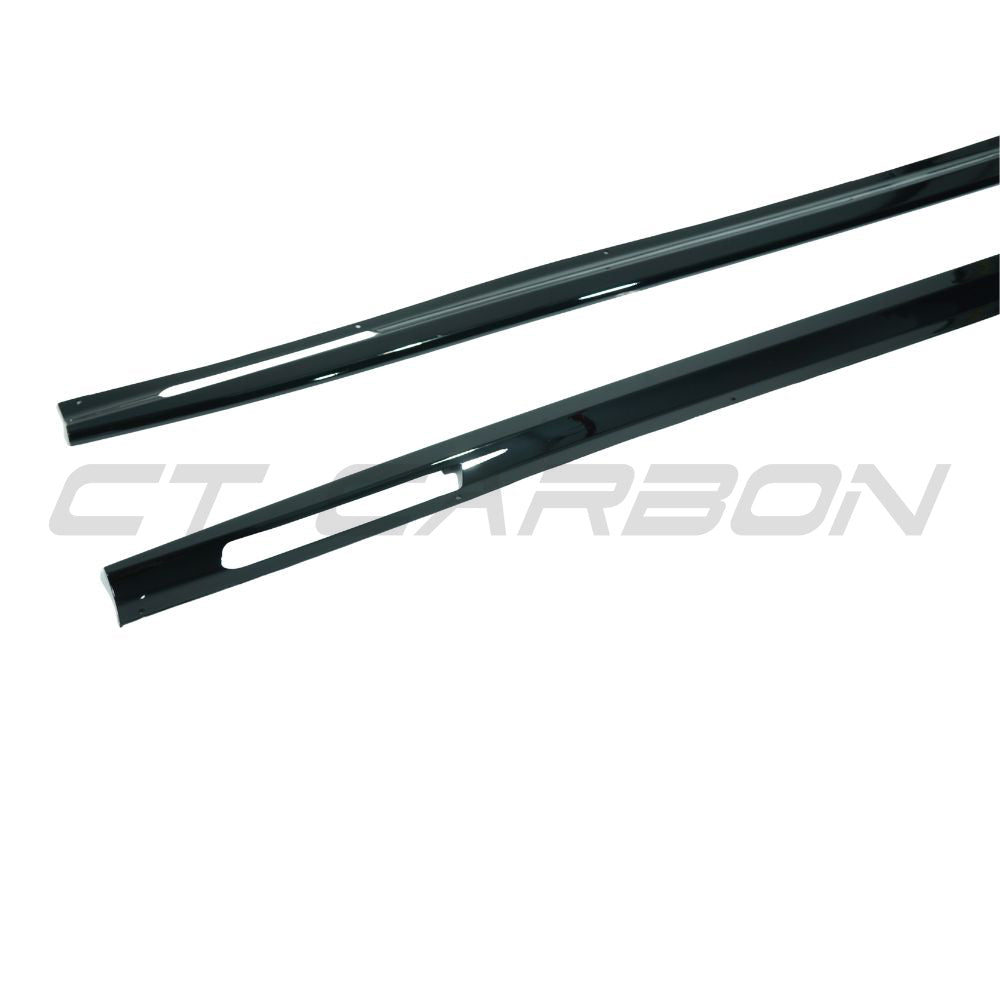 BMW 4 Series G22/G23 side skirts in gloss black from CT Carbon, showing the full-length aerodynamic design on the vehicle.
