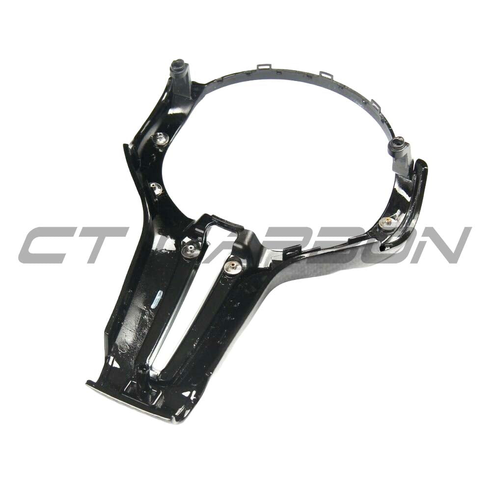 BMW Fxx M carbon fibre steering wheel trim accessory by CT Carbon, showcasing sleek, textured carbon fibre detail on the wheel.