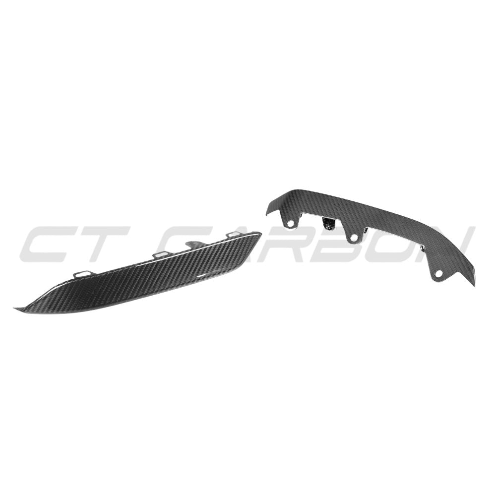 BMW M8 F91/F92/F93 carbon fibre lower front bumper trim by CT Carbon, close-up of sleek, textured automotive accessory.