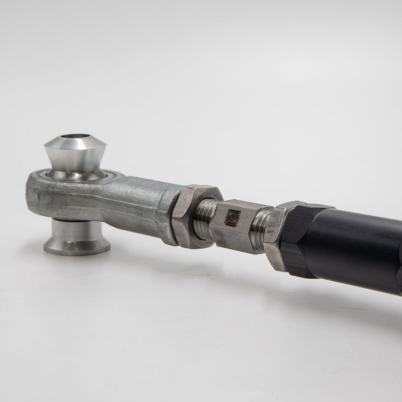 Suspension Secrets adjustable rear camber arms for BMW F20 M135I/M140I, part of the kinematics kit, with metal components and mounting points.