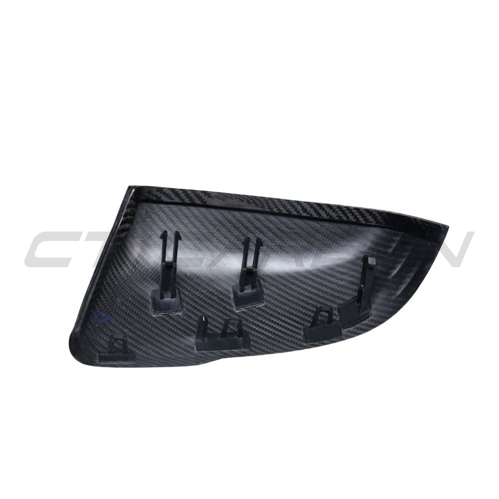 Toyota Supra A90 carbon fibre mirror accessories by CT Carbon, close-up of sleek, lightweight side mirrors for sporty appearance.