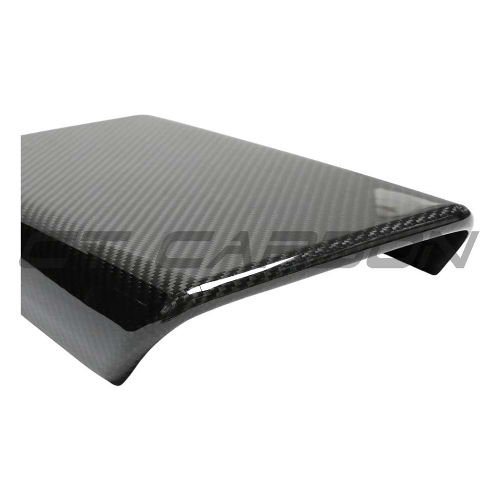 Tesla Model Y 2025+ facelift dry carbon armrest cover by CT Carbon, close-up view of sleek carbon fiber accessory in vehicle interior.