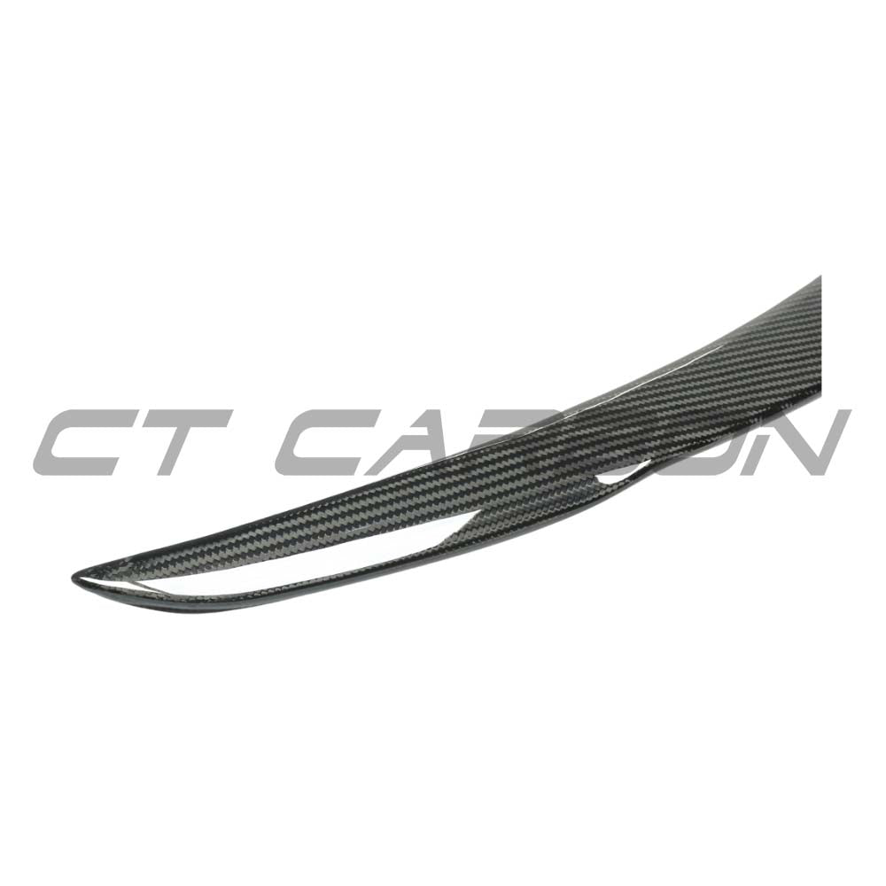 Tesla Model Y 2025+ facelift dry carbon spoiler by CT Carbon, showcasing sleek aerodynamic design on the vehicle.