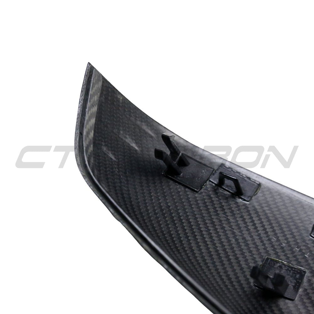 Toyota Supra A90 carbon fibre mirrors, car accessories by CT Carbon, close-up view of sleek, lightweight mirror covers on the vehicle.
