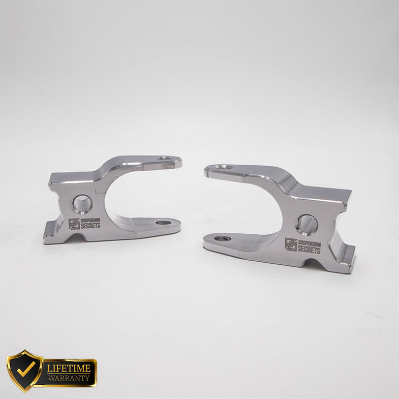 Suspension Secrets front camber blocks for Porsche 911 GT3 RS 992, showing sturdy suspension linkages with metal finish.