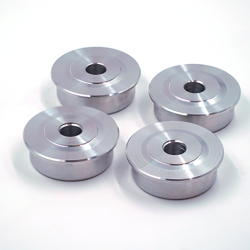 Rear solid control arm bush inserts for Porsche Boxster and Cayman suspension linkages, showing the durable bush components.