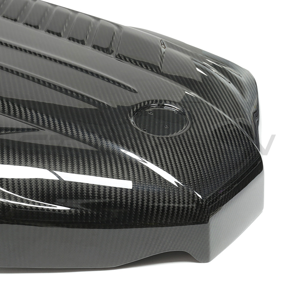 Toyota Supra A90 3.0T B58 carbon fibre engine cover by CT Carbon, showcasing sleek, lightweight engine accessory with a carbon fiber finish.
