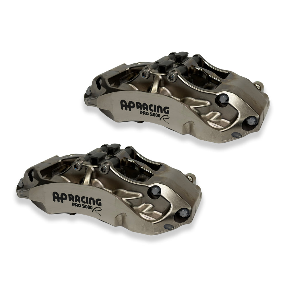 Pair of AP Racing Pro5000R big brake calipers with nickel finish, 6-piston design, for high-performance brake kits.
