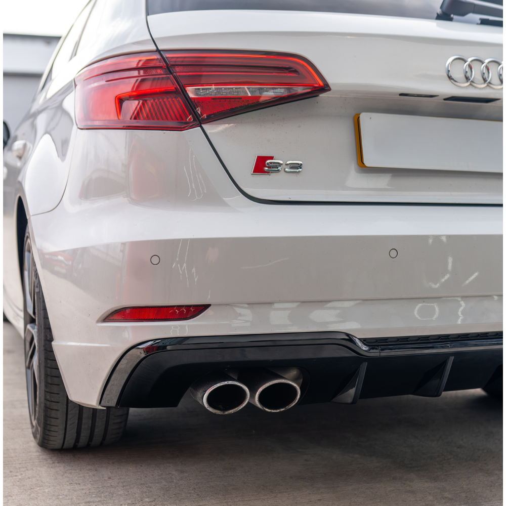 Gloss black diffuser for Audi A3/S3 8V facelift Sportback 5-door, made by CT Carbon, shown installed on the rear of the vehicle.