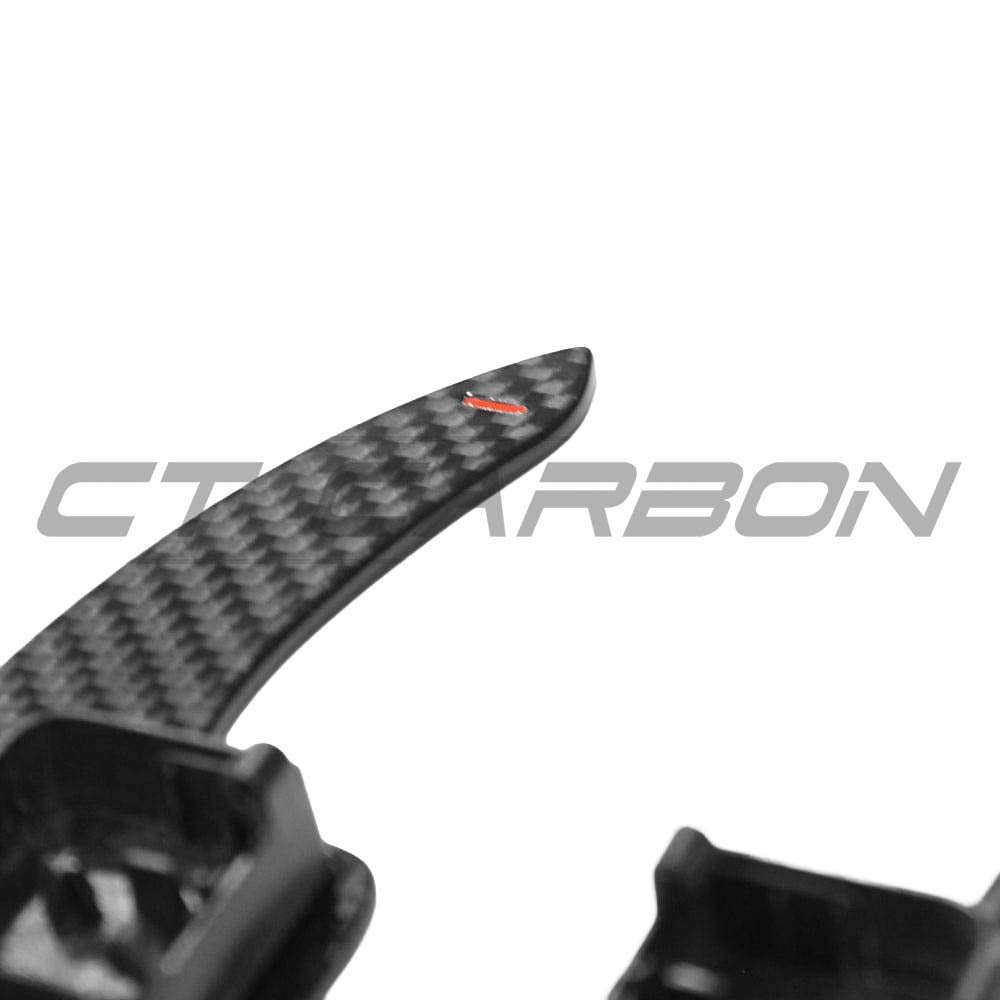 Audi A3, S3, RS3 8V carbon fiber shifter paddles by CT Carbon, close-up of sleek, lightweight racing-style car accessories.