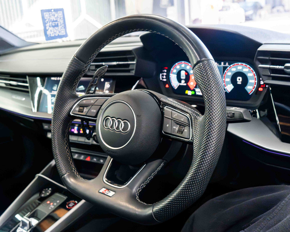 Audi A3/S3/RS3 and A4/S4/RS4 carbon fiber magnetic shifter paddles by CT Carbon, close-up view of sleek, lightweight accessories.