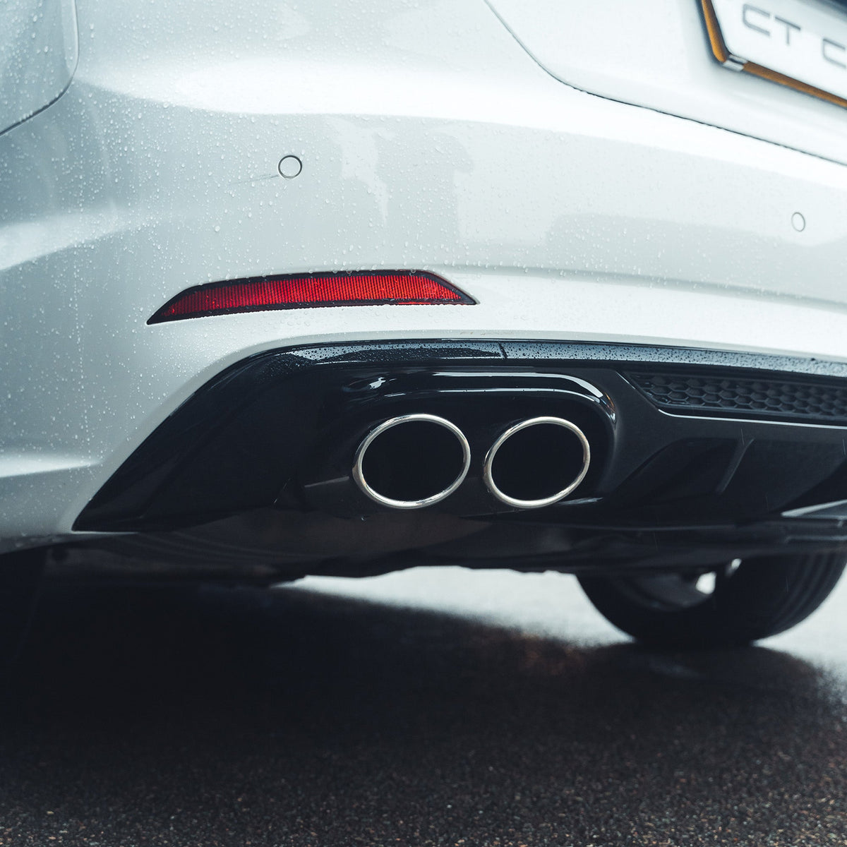CT Carbon gloss black diffuser for AUDI A5/S5 B9 2016-2019, showing sleek aerodynamic design on a sporty vehicle.
