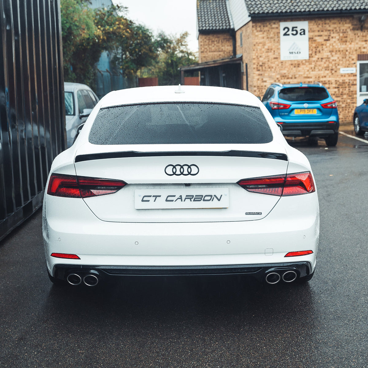 Gloss black diffuser for Audi A5/S5 B9 2016-2019 by CT Carbon, showcasing sleek aerodynamic design for a sporty look.