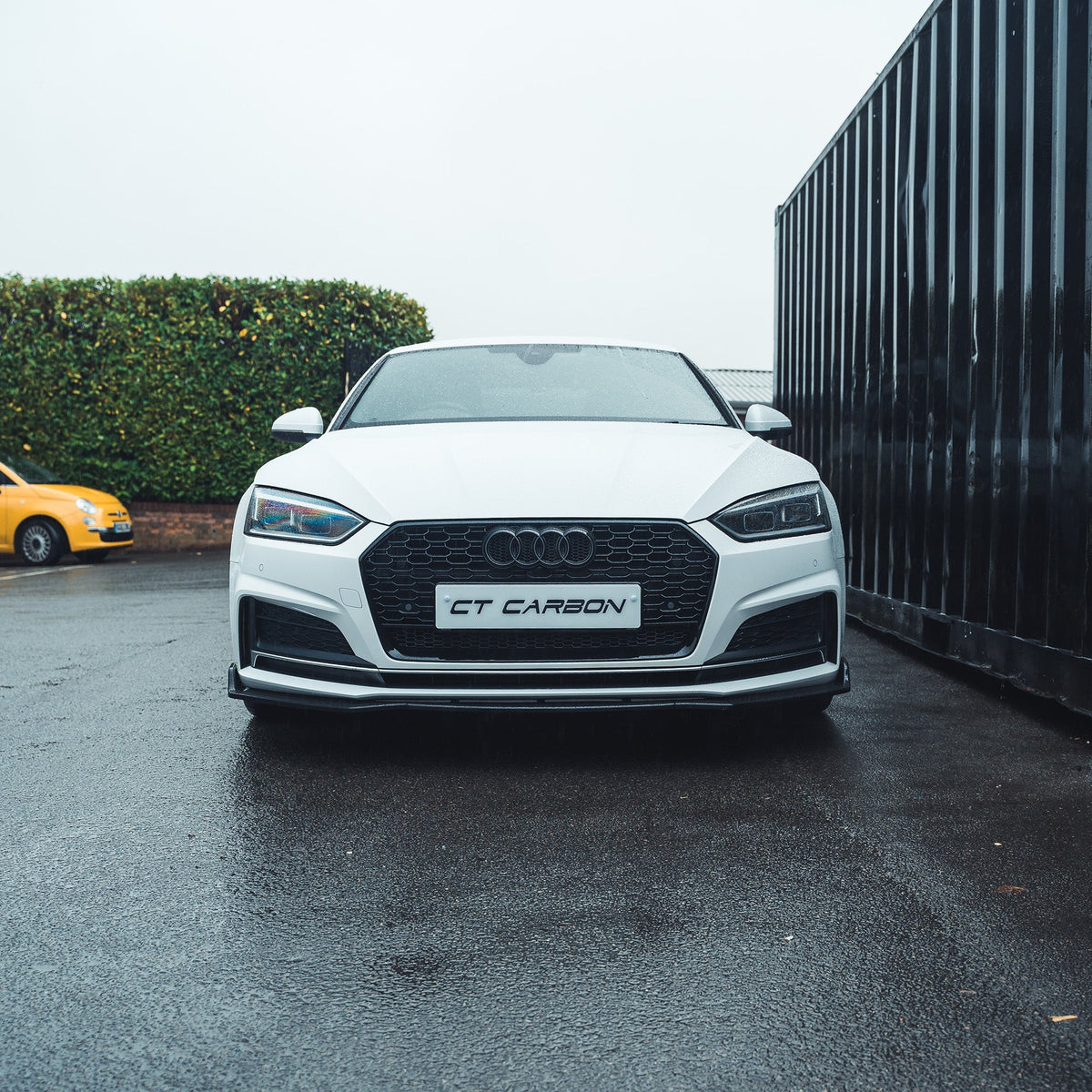 Gloss black CT Carbon splitter for Audi A5/S5 B9 (2016-2019) showcasing the sleek aerodynamic design and premium finish.