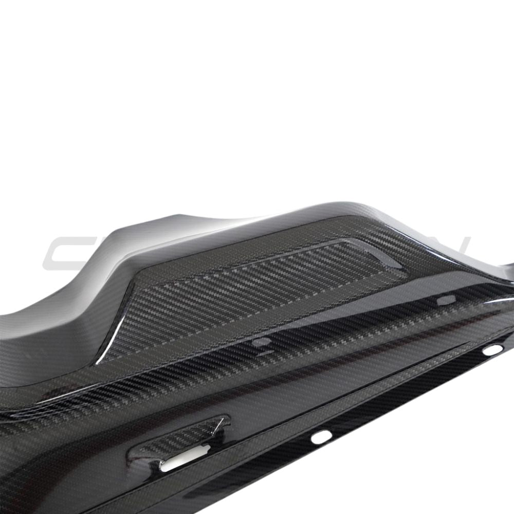 Audi R8 Coupe 2015+ Carbon Fibre Engine Bay Trim by CT Carbon, close-up of sleek, glossy carbon-fiber engine bay accessory.