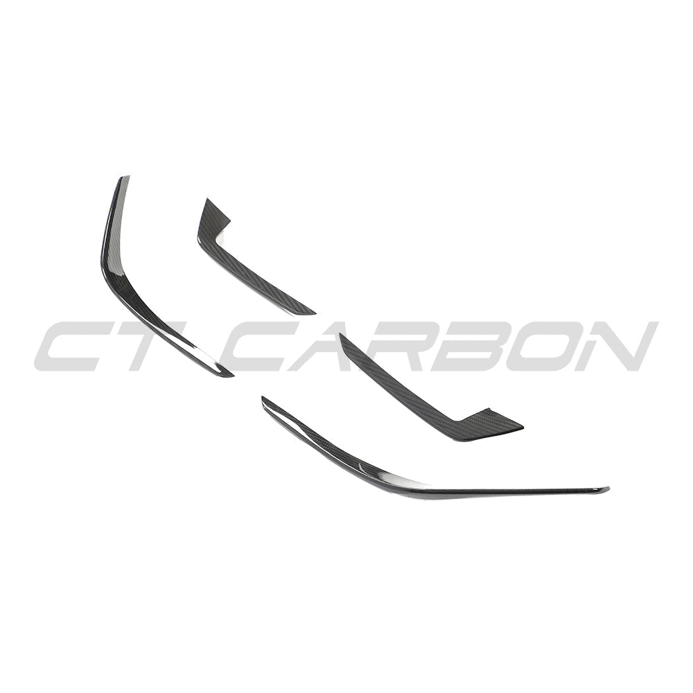 Audi RS4 B9.5 carbon fiber front canards by CT Design, showcasing aerodynamic accessories with a sleek carbon fiber finish.