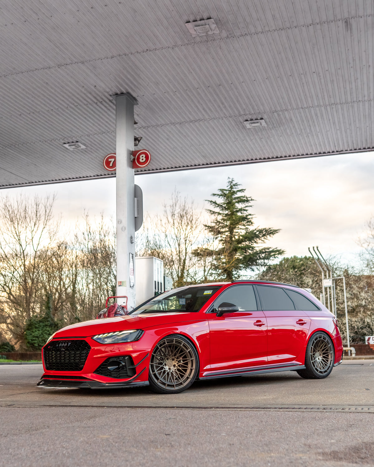 Audi RS4 B9.5 carbon fiber side skirts by CT Carbon, designed for sporty enhancement, mounted on the vehicle's sides.