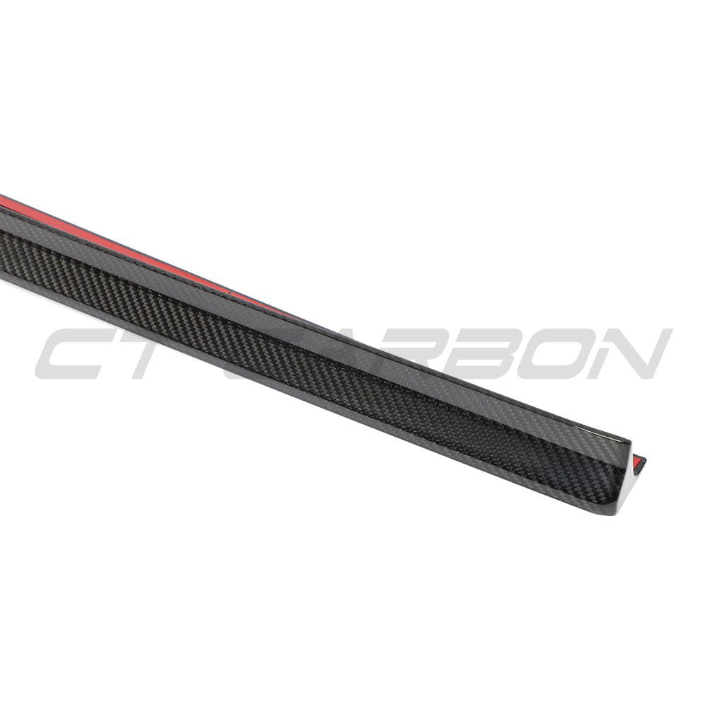 Audi RS4 B9.5 carbon fibre side skirts by CT Design, featuring sleek, lightweight aerodynamic enhancements visible from the side view.