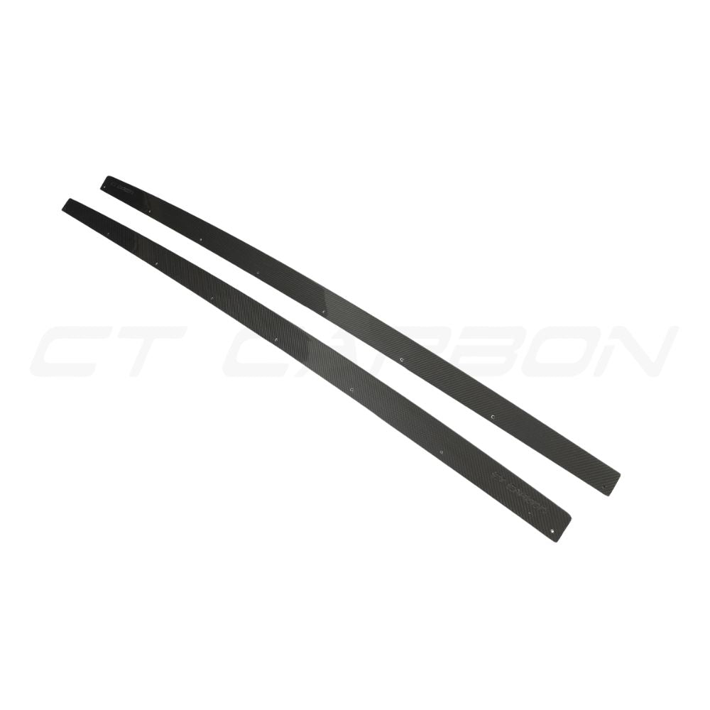 Audi RS4 B9.5 carbon fiber side skirts by CT Design, showcasing sleek, aerodynamic side panels with a textured carbon fiber finish.