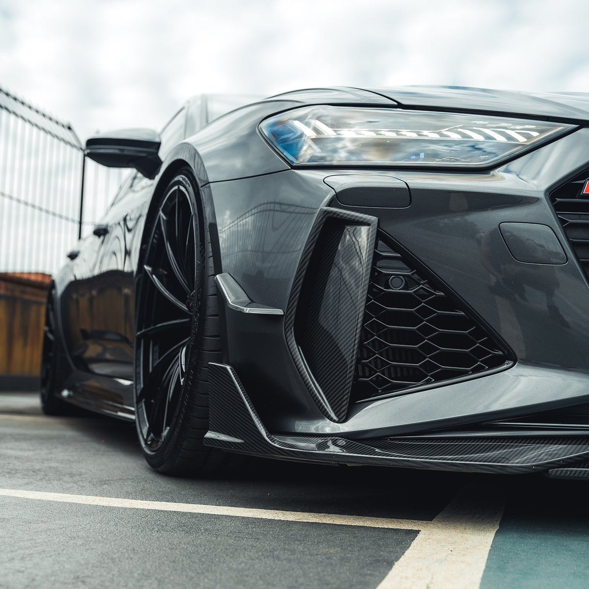 Carbon fiber front bumper vent trim for Audi RS6/RS7 C8 Avant 2019+ by CT Carbon, shown on the vehicle's front bumper.