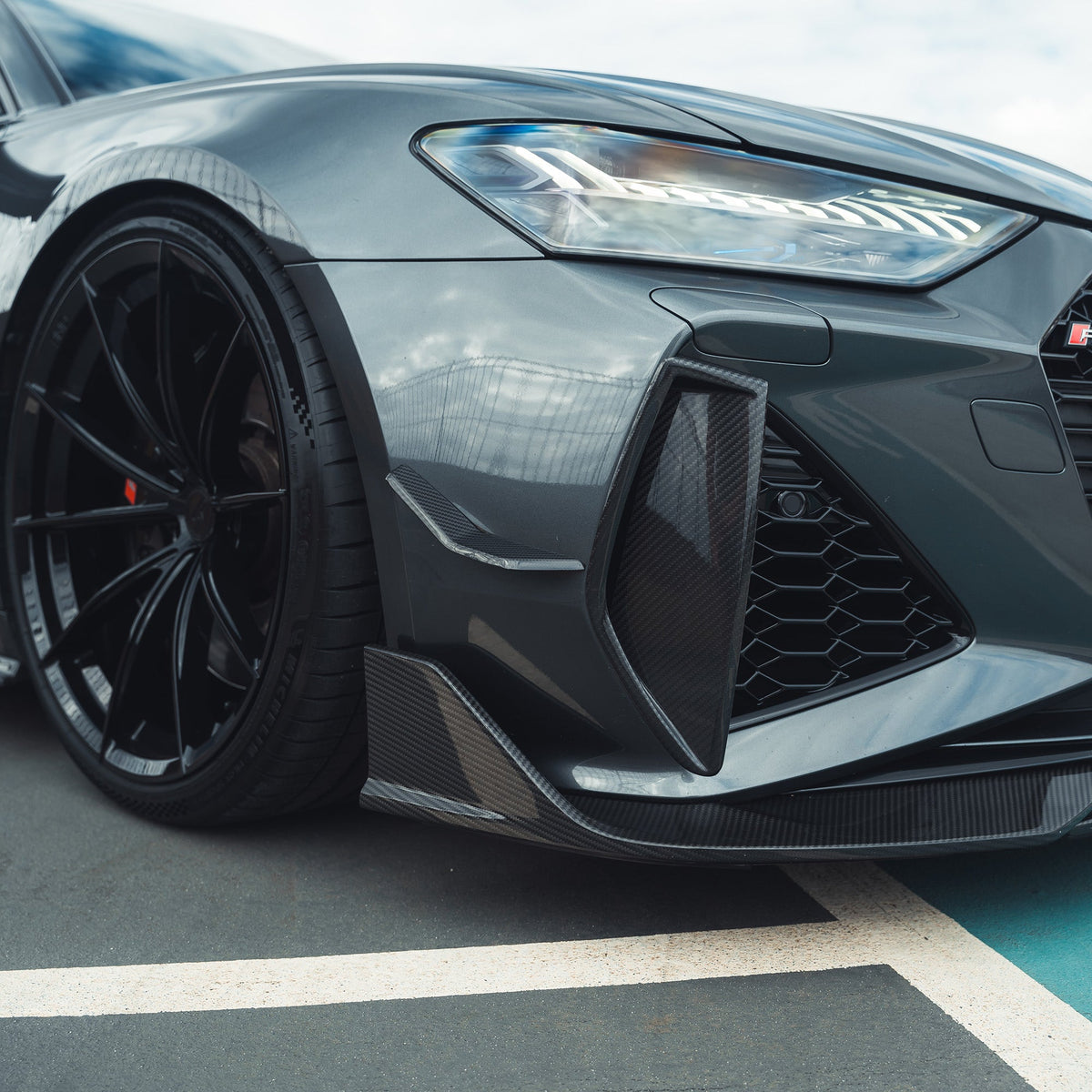 Carbon fiber front bumper vent trim for AUDI RS6/RS7 C8 Avant 2019+ by CT Carbon, showing sleek automotive accessory detail.