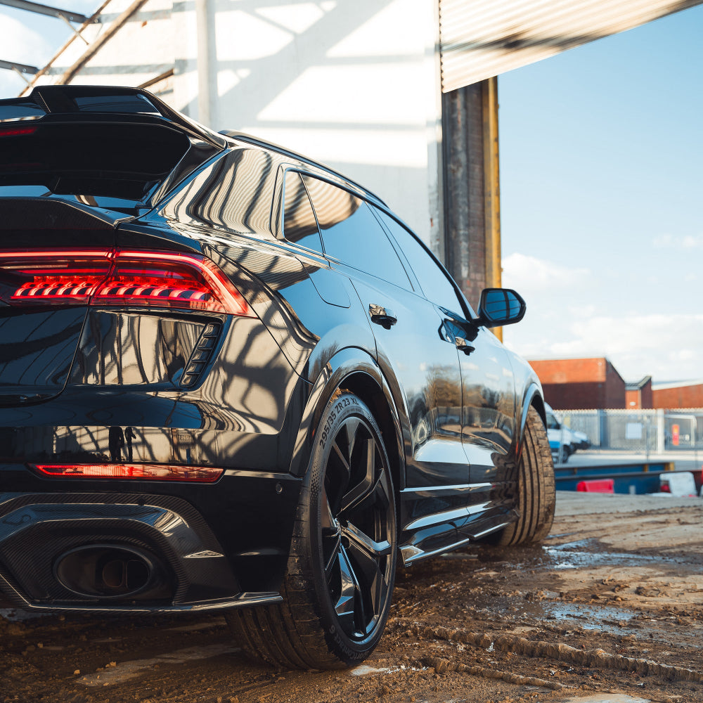 Audi RSQ8 2020+ carbon fibre side skirts by CT Carbon, showcasing sleek, lightweight aerodynamic enhancements.