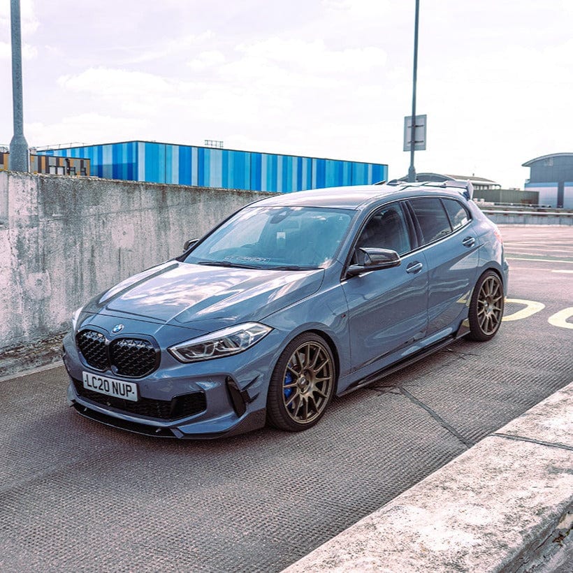 BMW 1 Series F40 carbon fibre side skirts by CT Design, featuring sleek, lightweight automotive body kit enhancements.