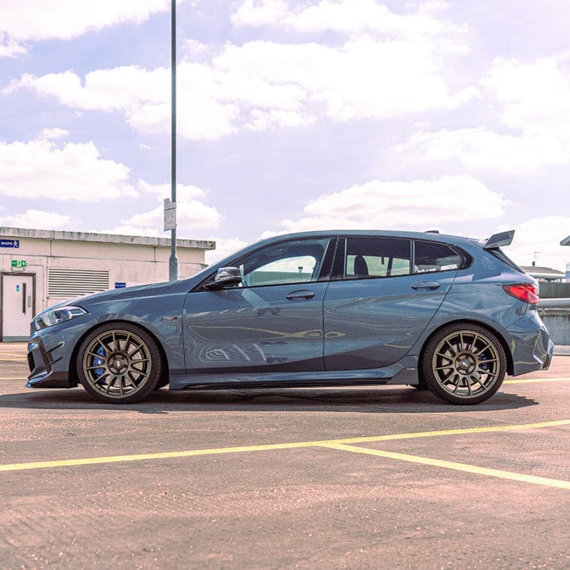 BMW 1 Series F40 carbon fibre side skirts by CT Carbon, featuring sleek design and lightweight construction for enhanced style.