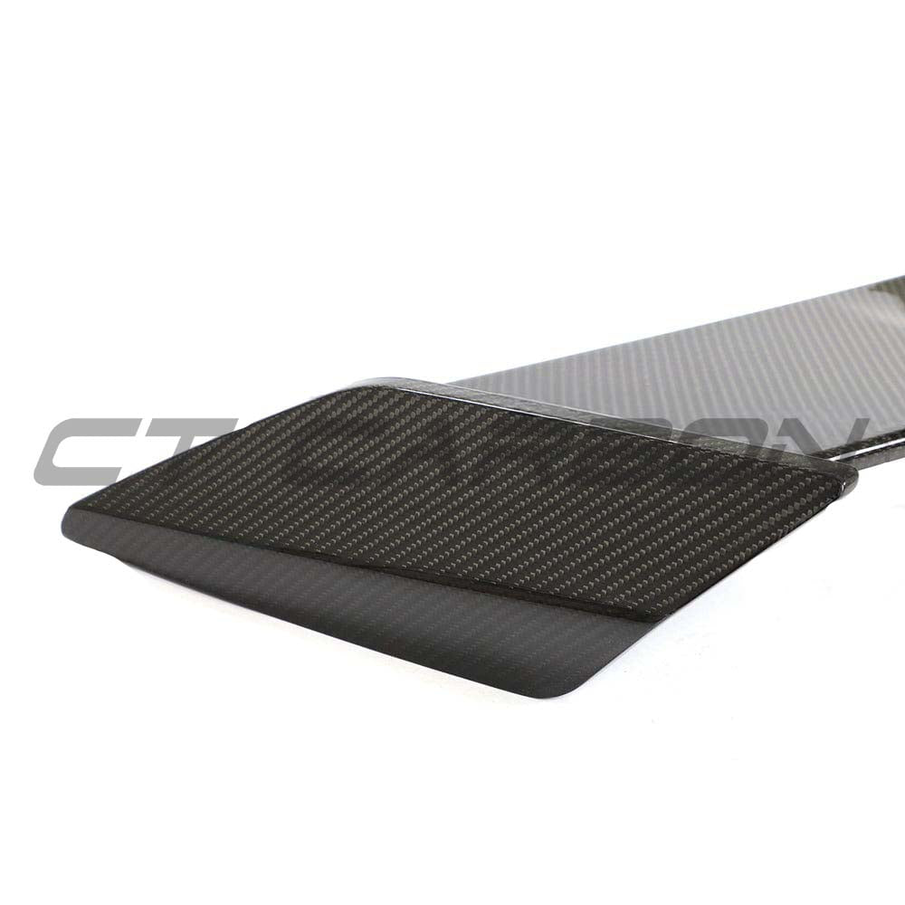 BMW 1 Series F40 and F70 carbon fibre wing spoiler by CT Design, showcasing its sleek, aerodynamic design for enhanced performance.